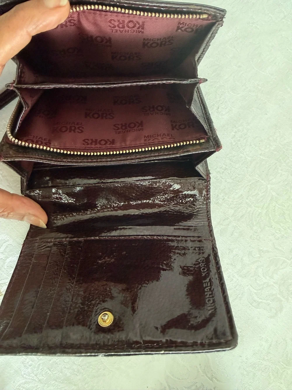 Michael Kors Burgundy patent bifold wallet with Gold Studs